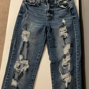 Distressed Vintage Blue Denim Jeans with Ripped Detailing